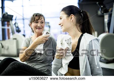 Woman talking with each other View Large Photo Image Stock Photo - Woman talking with each other. Fotosearch