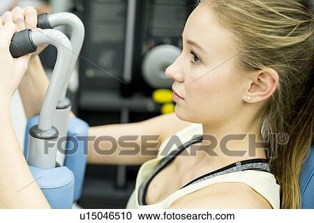 Woman using butterfly machine View Large Photo Image Stock Image - Woman using butterfly machine. Fotosearch