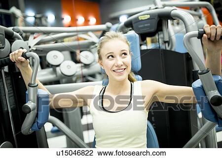 Woman using butterfly machine View Large Photo Image Stock Image - Woman using butterfly machine. Fotosearch