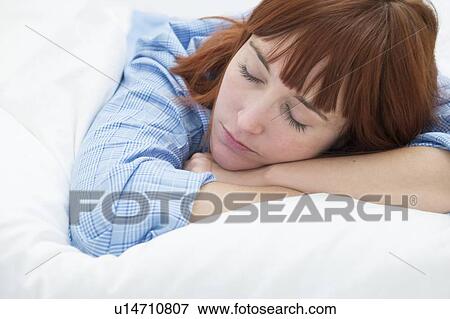 Woman with hand in hair View Large Photo Image Stock Photo - Woman with hand in hair. Fotosearch