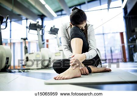 Young woman having ankle pain View Large Photo Image Stock Photo - Young woman having ankle pain. Fotosearch