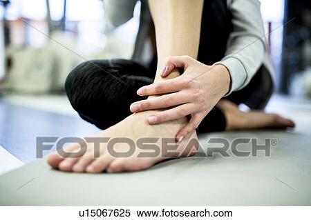 Young woman having ankle pain View Large Photo Image Stock Photography - Young woman having ankle pain. Fotosearch