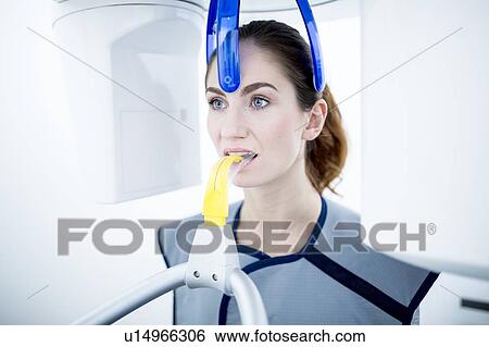 Young woman having dental x-ray View Large Photo Image Stock Photograph - Young woman having dental x-ray. Fotosearch