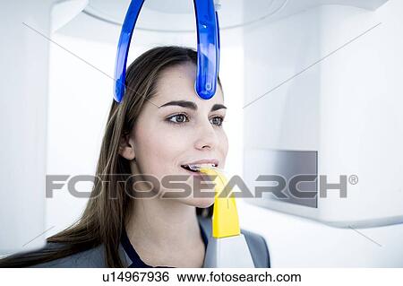Young woman having dental x-ray View Large Photo Image Stock Photograph - Young woman having dental x-ray. Fotosearch