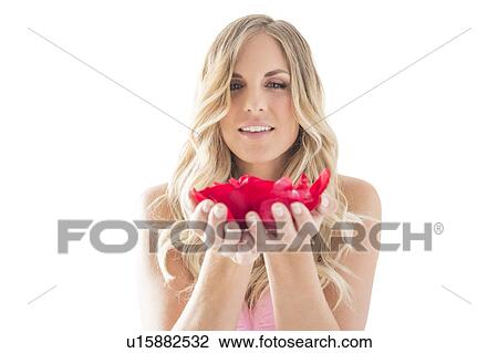 Young woman holding rose petals in hands View Large Photo Image Stock Image - Young woman holding rose petals in hands. Fotosearch