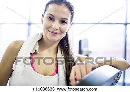 Young woman in gym, close-up, portrait View Large Photo Image Stock Image - Young woman in gym, close-up, portrait. Fotosearch