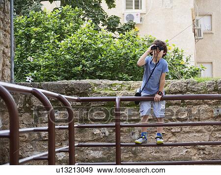 Boy of seven with a binocular View Large Photo Image Stock Photo - Boy of seven with a binocular. Fotosearch