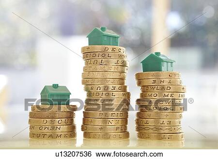 British pound coins with model houses View Large Photo Image Stock Photograph - British pound coins with model houses. Fotosearch