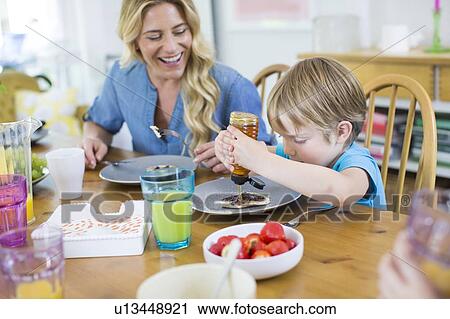 Child eating pancake View Large Photo Image Stock Image - Child eating pancake. Fotosearch