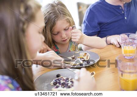 Child eating pancake View Large Photo Image Stock Image - Child eating pancake. Fotosearch
