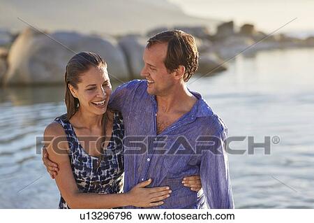 Stock Photograph - Couple by the sea. Fotosearch