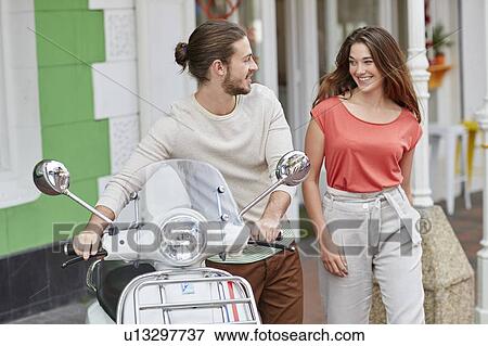 Couple outside caf View Large Photo Image Stock Photo - Couple outside caf. Fotosearch