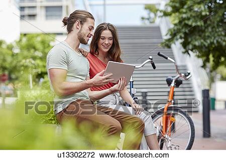 Stock Image - Couple with digital tablet. Fotosearch