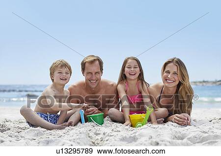 Stock Photo - Family on the beach. Fotosearch