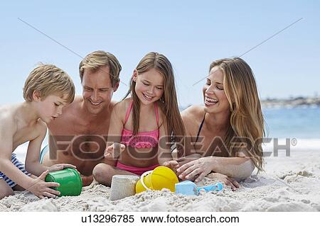 Family on the beach View Large Photo Image Stock Photography - Family on the beach. Fotosearch