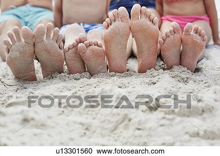 Family sitting on beach View Large Photo Image Stock Image - Family sitting on beach. Fotosearch