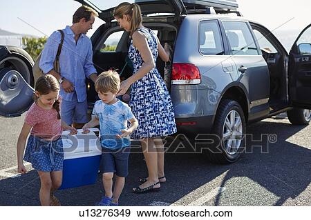 Family unpacking the car View Large Photo Image Stock Photo - Family unpacking the car. Fotosearch