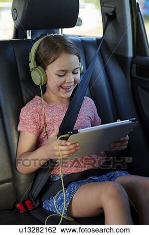 Girl wearing headphones View Large Photo Image Stock Image - Girl wearing headphones. Fotosearch
