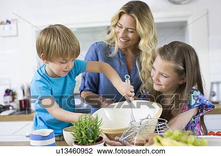 Mother and children in the kitchen View Large Photo Image Stock Image - Mother and children in the kitchen. Fotosearch