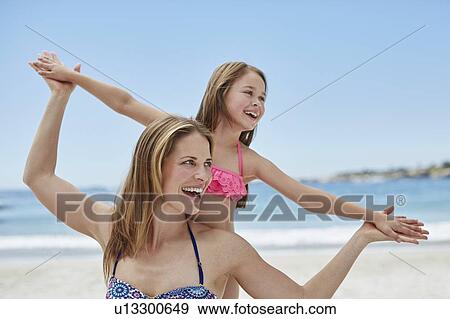 Mother and daughter on beach View Large Photo Image Stock Photo - Mother and daughter on beach. Fotosearch