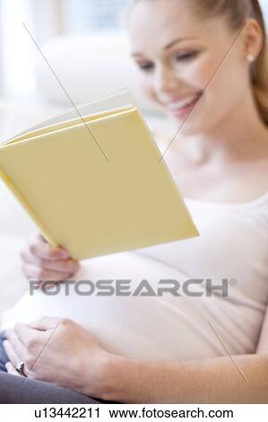 Pregnant woman reading book View Large Photo Image Stock Image - Pregnant woman reading book. Fotosearch