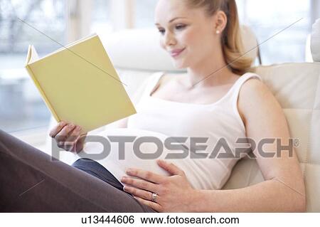 Pregnant woman reading book View Large Photo Image Stock Photograph - Pregnant woman reading book. Fotosearch