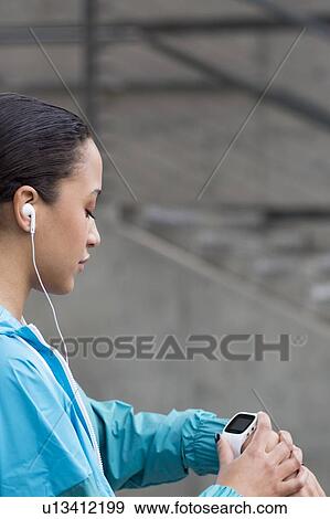 Woman checking watch View Large Photo Image Stock Photo - Woman checking watch. Fotosearch