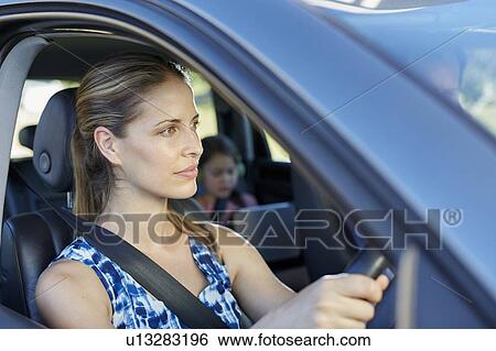 Woman driving car View Large Photo Image Stock Photograph - Woman driving car. Fotosearch