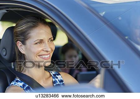 Stock Photograph - Woman driving car. Fotosearch