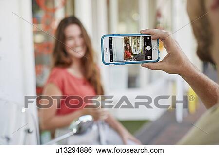 Woman having photo taken View Large Photo Image Stock Photograph - Woman having photo taken. Fotosearch