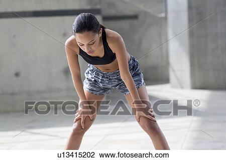 Woman recovering after exercise View Large Photo Image Stock Image - Woman recovering after exercise. Fotosearch