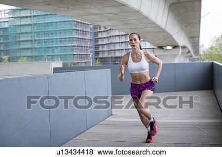 Stock Photo - Woman running. Fotosearch
