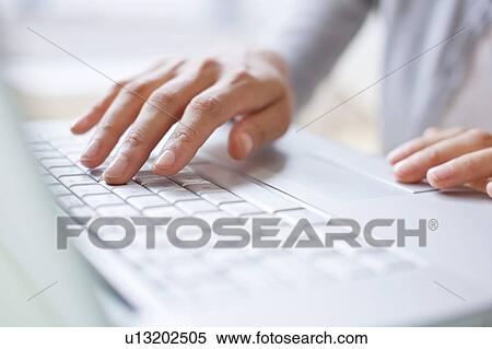 Woman using laptop View Large Photo Image Stock Photography - Woman using laptop. Fotosearch
