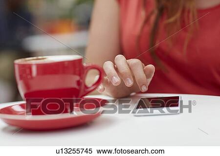 Woman using smartphone with coffee View Large Photo Image Stock Photography - Woman using smartphone with coffee. Fotosearch