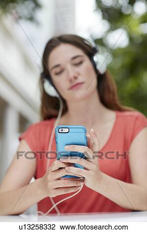 Woman wearing headphones View Large Photo Image Stock Image - Woman wearing headphones. Fotosearch