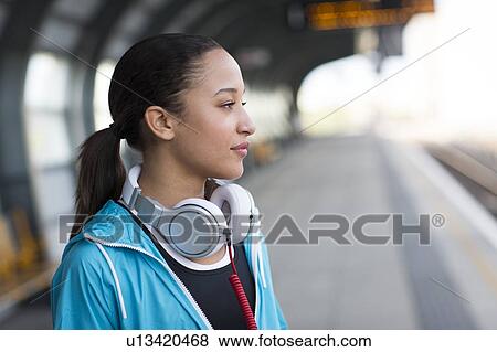 Stock Photo - Woman with headphones. Fotosearch