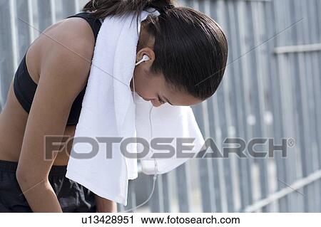 Woman with towel around neck, resting View Large Photo Image Stock Image - Woman with towel around neck, resting. Fotosearch