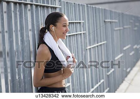 Woman with towel around neck View Large Photo Image Stock Image - Woman with towel around neck. Fotosearch