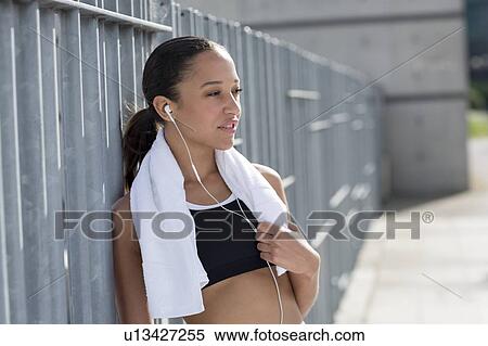 Woman with towel around neck View Large Photo Image Stock Photography - Woman with towel around neck. Fotosearch