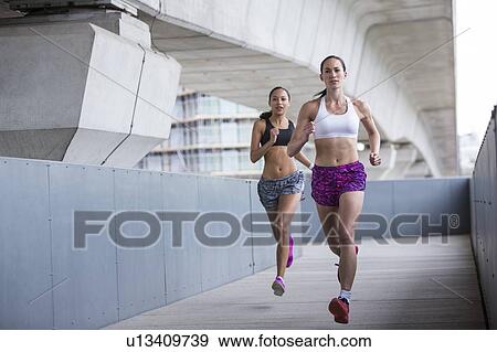 Women racing View Large Photo Image Stock Photo - Women racing. Fotosearch