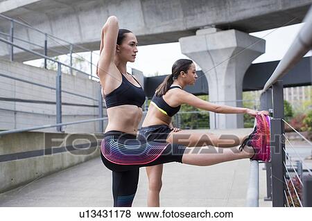 Women stretching after run View Large Photo Image Stock Photo - Women stretching after run. Fotosearch
