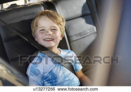 Young boy wearing seat belt View Large Photo Image Stock Photograph - Young boy wearing seat belt. Fotosearch