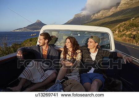 Young friends in pick up truck View Large Photo Image Stock Image - Young friends in pick up truck. Fotosearch