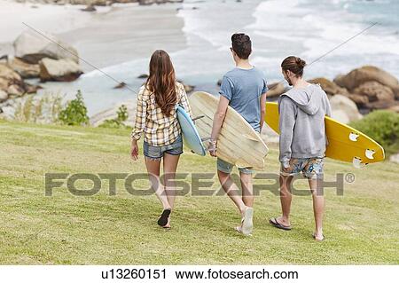 Young people on beach with surfboards View Large Photo Image Stock Image - Young people on beach with surfboards. Fotosearch