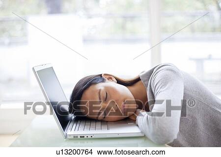 Young woman asleep on laptop View Large Photo Image Picture - Young woman asleep on laptop. Fotosearch