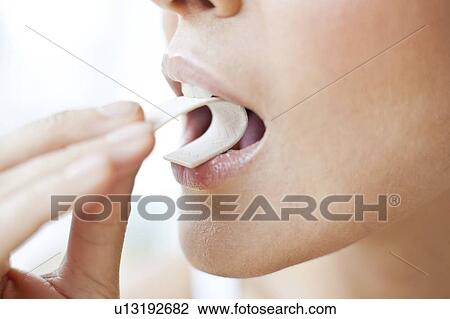 Young woman chewing gum View Large Photo Image Stock Image - Young woman chewing gum. Fotosearch