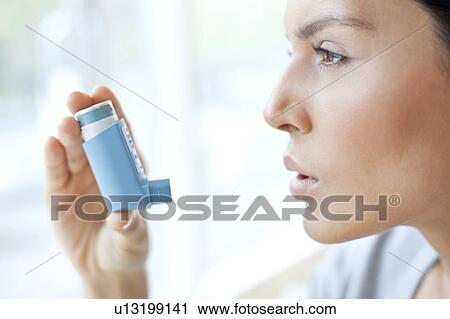 Young woman using inhaler View Large Photo Image Stock Image - Young woman using inhaler. Fotosearch