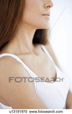 Stock Photography - Young woman wearing white vest. Fotosearch