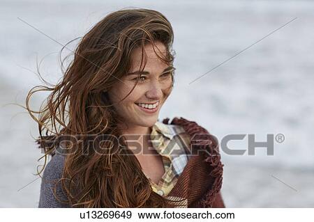 Young woman with brown hair View Large Photo Image Stock Photo - Young woman with brown hair. Fotosearch