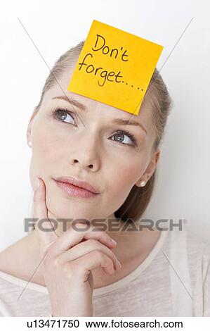 Young woman with sticky note View Large Photo Image Stock Image - Young woman with sticky note. Fotosearch
